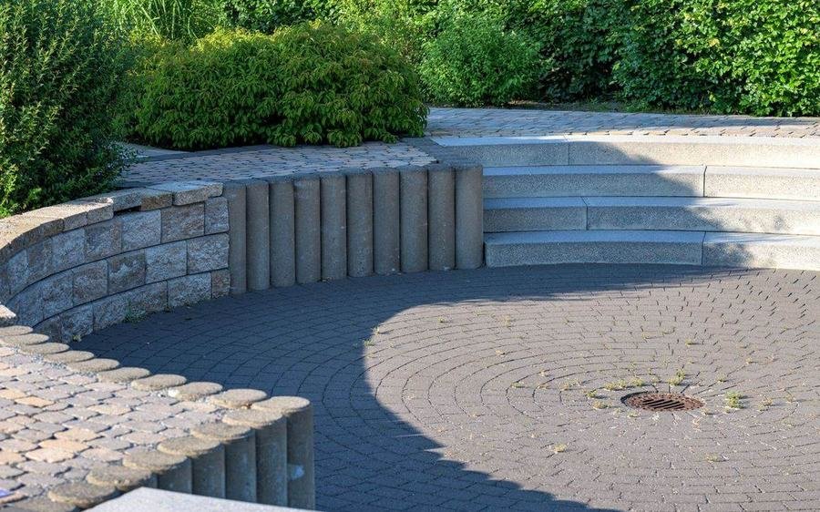 Custom stone patio and retaining wall hardscaping